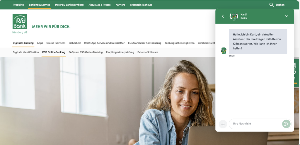 Woman smiling while using a laptop with a live chat window open on the screen, demonstrating customer support technology.