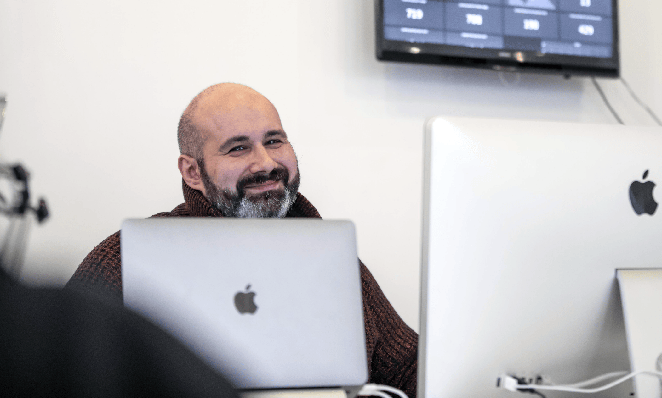 customer success team member sitting in front of a computer