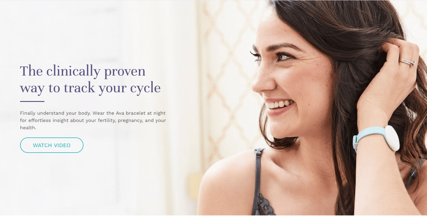 Smiling woman wearing a fertility bracelet