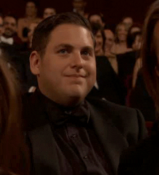 Jonah Hill gesturing to stop it.