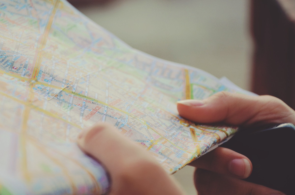 photograph picture of a map in the hands of a person