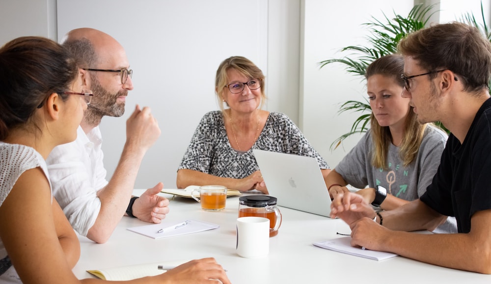 Userlike team members in a meeting.