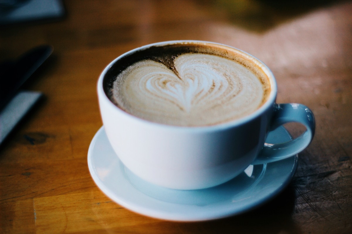 photograph picture of coffee cup with heart of foam