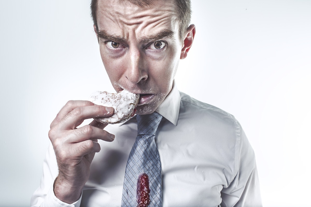 photograph picture of a manager eating a cookie