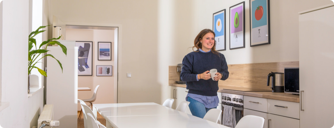 Tessa walking through the kitchen.