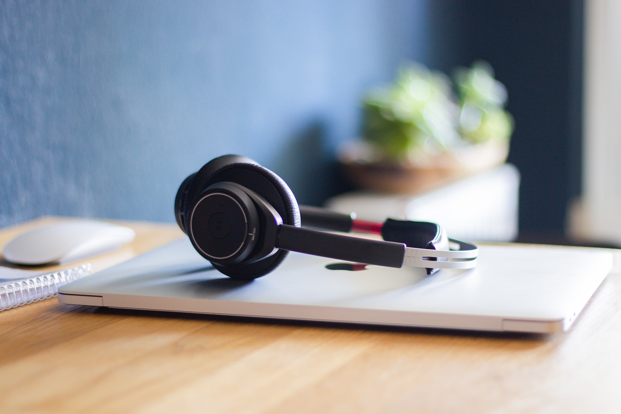 image of headset laying on a closed laptop